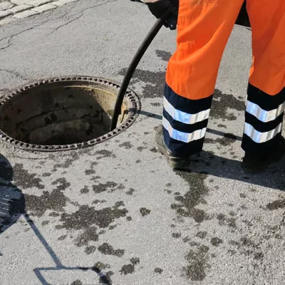 Operating a drain cleaning system